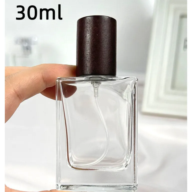 بطری تقسیم عطر با درپوش چوبی، بطری عطر قابل حمل لوکس با ظرفیت بالا، بطری خالی پمپی شیشه‌ای شفاف جایگزین