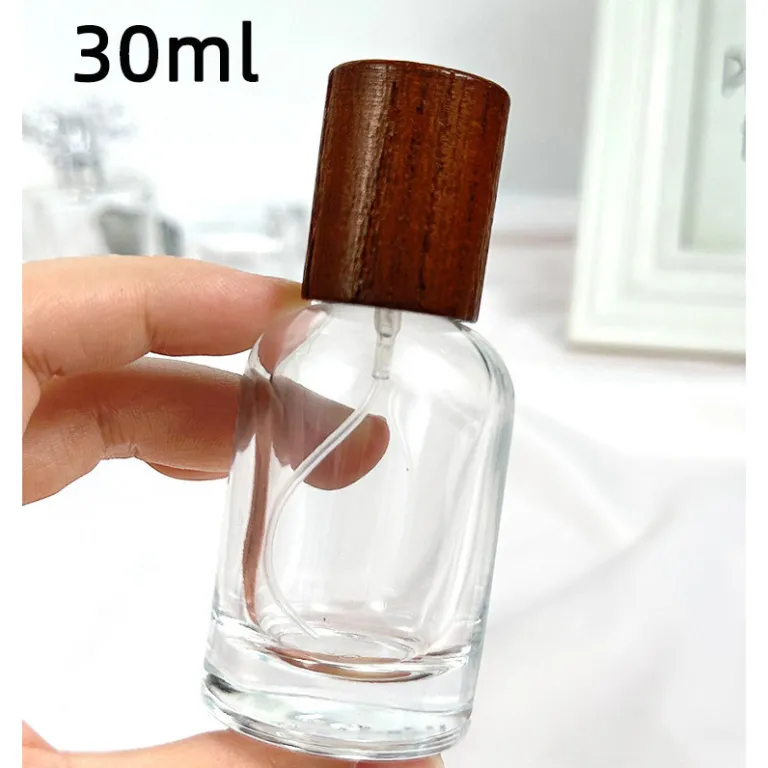 بطری تقسیم عطر با درپوش چوبی، بطری عطر قابل حمل لوکس با ظرفیت بالا، بطری خالی پمپی شیشه‌ای شفاف جایگزین