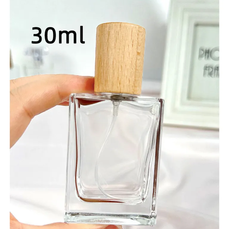 بطری تقسیم عطر با درپوش چوبی، بطری عطر قابل حمل لوکس با ظرفیت بالا، بطری خالی پمپی شیشه‌ای شفاف جایگزین