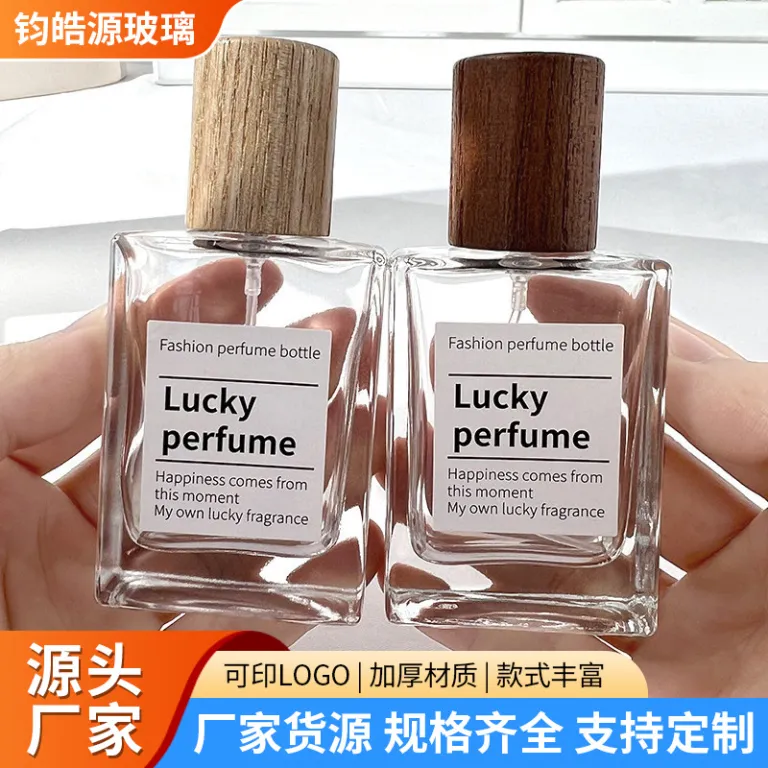 بطری تقسیم عطر با درپوش چوبی، بطری عطر قابل حمل لوکس با ظرفیت بالا، بطری خالی پمپی شیشه‌ای شفاف جایگزین