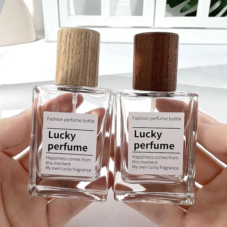 بطری تقسیم عطر با درپوش چوبی، بطری عطر قابل حمل لوکس با ظرفیت بالا، بطری خالی پمپی شیشه‌ای شفاف جایگزین