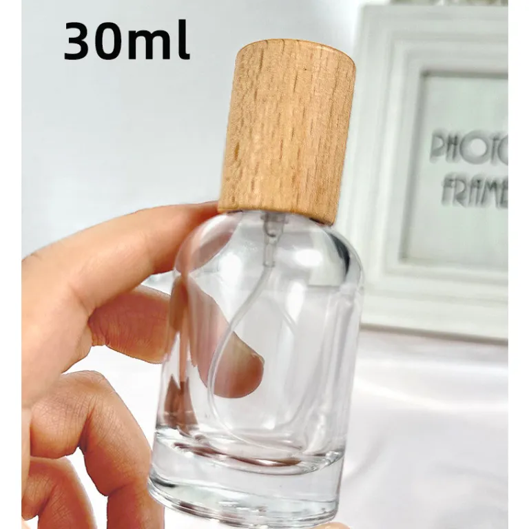 بطری تقسیم عطر با درپوش چوبی، بطری عطر قابل حمل لوکس با ظرفیت بالا، بطری خالی پمپی شیشه‌ای شفاف جایگزین
