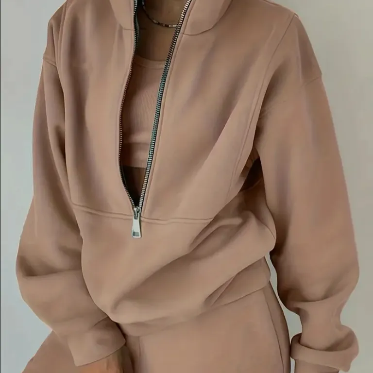 ست دو تکه سویشرت و شلوار ورزشی زنانه طرح اروپایی-آمریکایی گشاد و راحت با زیپ از جنس پلار کشباف مناسب منزل و استراحت