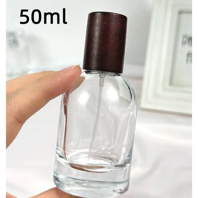 بطری تقسیم عطر با درپوش چوبی، بطری عطر قابل حمل لوکس با ظرفیت بالا، بطری خالی پمپی شیشه‌ای شفاف جایگزین