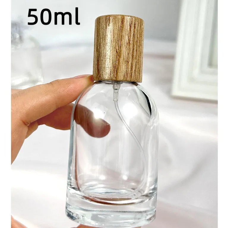 بطری تقسیم عطر با درپوش چوبی، بطری عطر قابل حمل لوکس با ظرفیت بالا، بطری خالی پمپی شیشه‌ای شفاف جایگزین