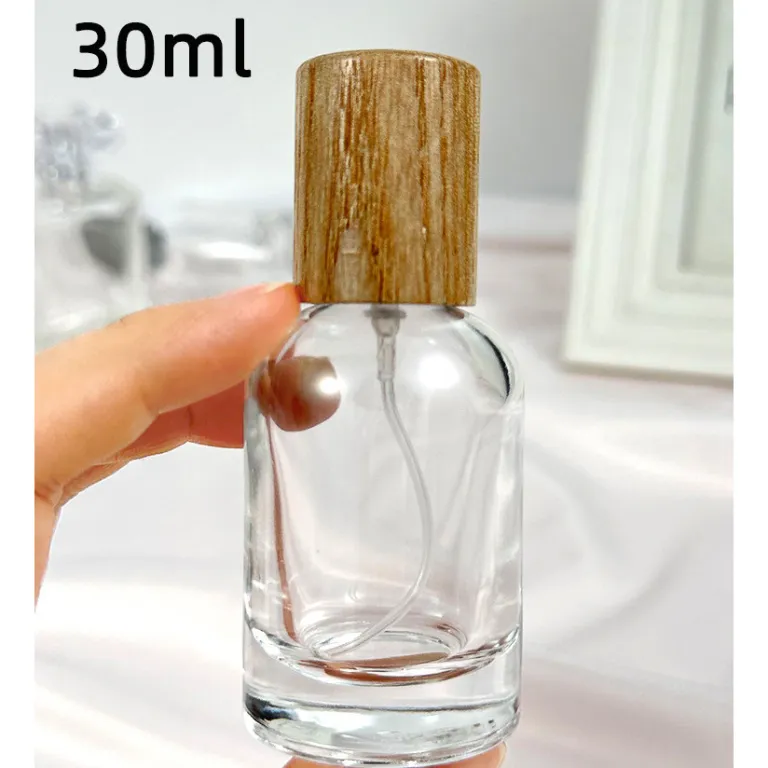 بطری تقسیم عطر با درپوش چوبی، بطری عطر قابل حمل لوکس با ظرفیت بالا، بطری خالی پمپی شیشه‌ای شفاف جایگزین