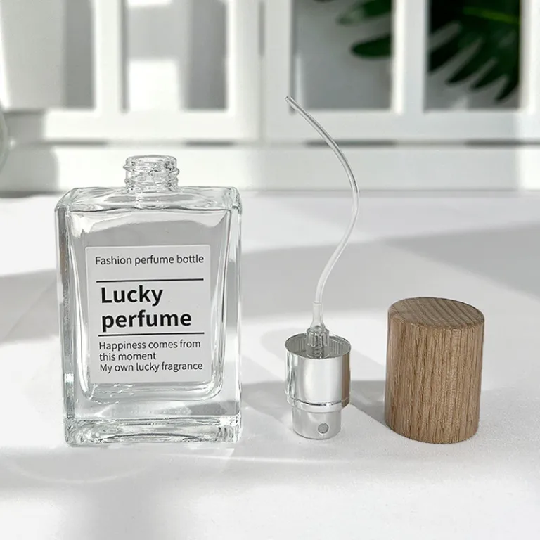 بطری تقسیم عطر با درپوش چوبی، بطری عطر قابل حمل لوکس با ظرفیت بالا، بطری خالی پمپی شیشه‌ای شفاف جایگزین