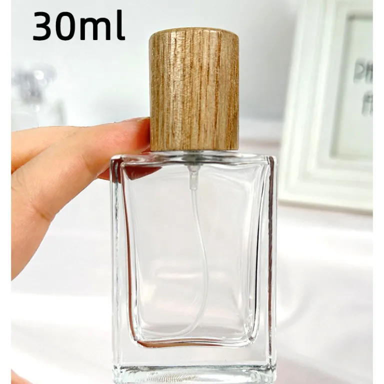 بطری تقسیم عطر با درپوش چوبی، بطری عطر قابل حمل لوکس با ظرفیت بالا، بطری خالی پمپی شیشه‌ای شفاف جایگزین