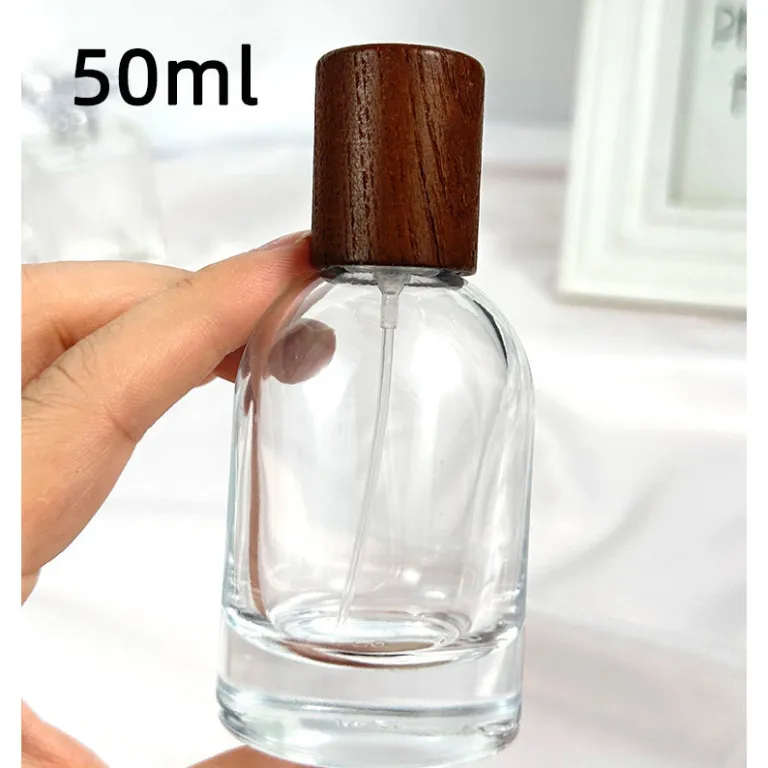 بطری تقسیم عطر با درپوش چوبی، بطری عطر قابل حمل لوکس با ظرفیت بالا، بطری خالی پمپی شیشه‌ای شفاف جایگزین