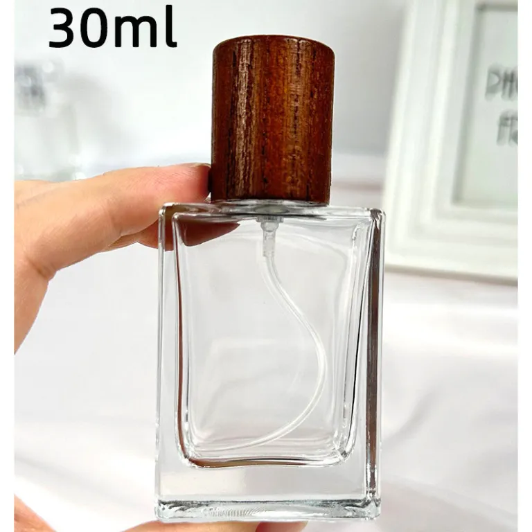 بطری تقسیم عطر با درپوش چوبی، بطری عطر قابل حمل لوکس با ظرفیت بالا، بطری خالی پمپی شیشه‌ای شفاف جایگزین