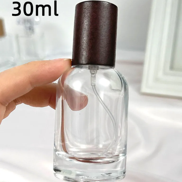 بطری تقسیم عطر با درپوش چوبی، بطری عطر قابل حمل لوکس با ظرفیت بالا، بطری خالی پمپی شیشه‌ای شفاف جایگزین